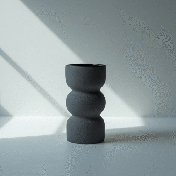 grey sculpted ceramic vase with rounded silhouette in matte finish from Mint LB