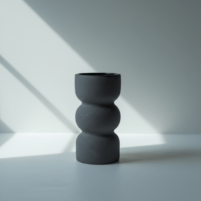 grey sculpted ceramic vase with rounded silhouette in matte finish from Mint LB