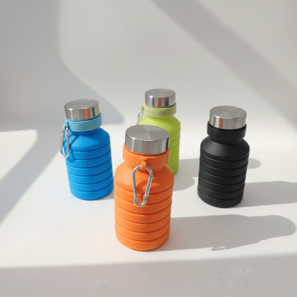 Four compact silicone water bottles in blue, orange, lime green, and black with ribbed body, screw caps, and carabiners; multi-color silicone water bottle, available at Mint LB Zahle Lebanon