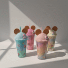 Colorful fun pastel kids water bottle with ice-cream textured lid, cookie-style ears, and reusable straw, available at Mint LB Zahle Lebanon