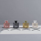 Modern coral ribbed glass diffuser with vertical textured lines, compact square shape, available at Mint LB Zahle Lebanon