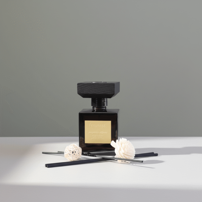 Sleek black home fragrance diffuser with gold label and sculptural design, black home fragrance, available at Mint LB Zahle Lebanon