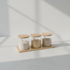 Three-piece natural minimalist spice jar set with clear containers, neutral lids, and matching spoons on a rectangular base, natural minimalist spice jar set, available at Mint LB Zahle Lebanon