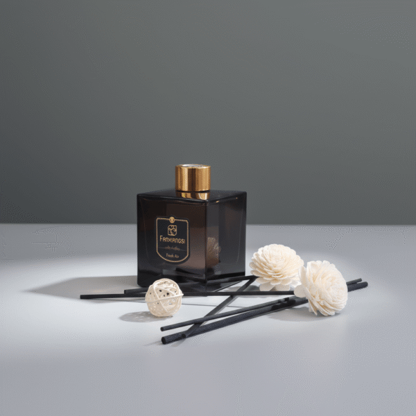 Modern smoky black reed diffuser with gold accents, decorative flower sticks, and black reeds, available at Mint LB Zahle Lebanon