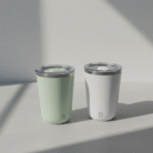 Minimalist sage green and white insulated mug with matte finish, splash-resistant lid and silver trim, sage green white insulated mug, available at Mint LB Zahle Lebanon