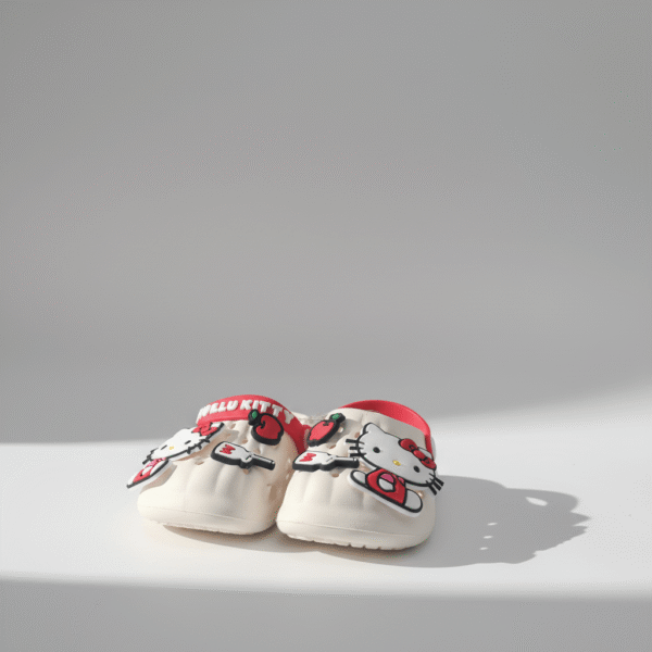 Adorable cream kids clogs with Hello Kitty and cherry detail, red strap, cream base, cream kids clogs, available at Mint LB Zahle Lebanon
