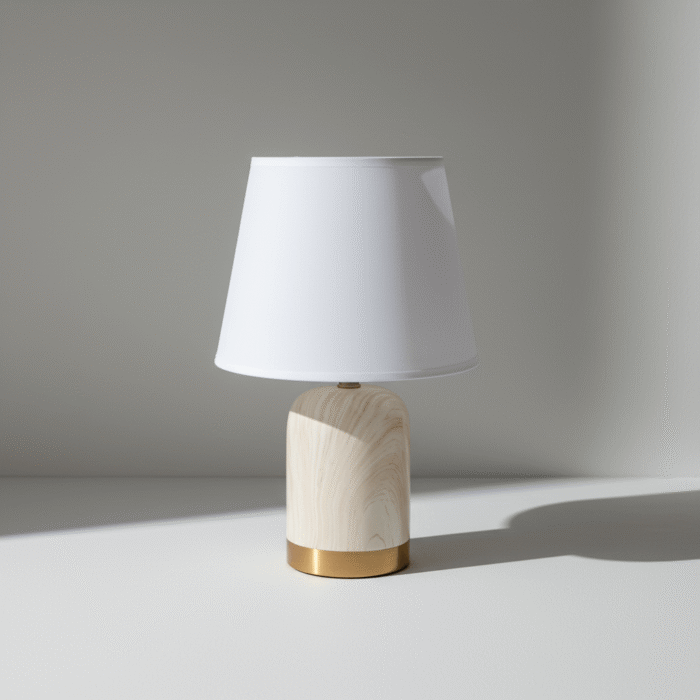 Modern cream linen bedside lamp with smooth textured base and gold accent, available at Mint LB Zahle Lebanon