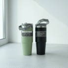 Modern sage green and black travel mug with matte smooth finish and integrated handle, sage green and black travel mug, available at Mint LB Zahle Lebanon